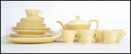 A vintage 20th century art deco part tea and dinner service by Woods in the Jasmine pattern