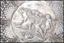 A large 19th century German silver centrepiece bowl having a pierced serpentine edge with scrolls