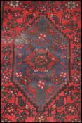 A 20th century Kelim woolen rug / runner , on red ground with a central medallion, inner border with