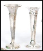 A collection of silver and silver plated items to include a plated wine bottle coaster with