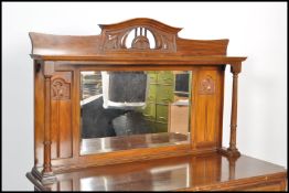 A 19th century walnut Arts & Crafts mirror back sideboard dresser. Raised on plinth base with