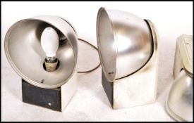 A group of four vintage / retro Industrial 20th century unusual shaped aircraft hanger lights, set