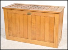 An unusual mid century large oak eclesiastical vestment - front chest coffer. Of light oak form with