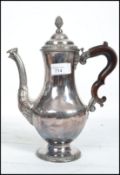 An 18th century George III silver plated coffee pot in the manner of Hester Bateman. Baluster form
