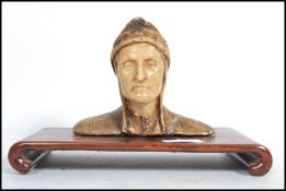 A vintage 20th century moulded figure bust modelled as  Dante raised on a shaped plinth base. Repair
