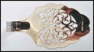 A stunning 20th century silver hallmarked slice having a fret work foliate design to the blade
