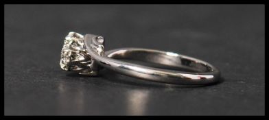 An 18ct white gold and platinum diamond ring having two approx 10pt diamonds in a crossover setting.