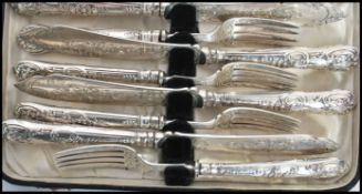 A 19th century Victorian silver hallmarked six person knife and fork set consisting of six silver