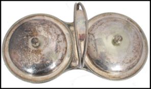 A vintage 20th century silver plated twin handled muffin warmer centre piece. Each with round tureen