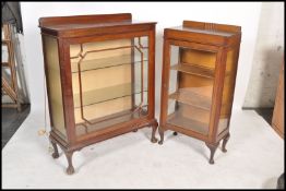 An Edwardian mahogany bookcase / display cabinet being raised on cabriole legs having twin astagal