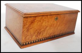 A 19th century Victorian birds eye maple box being cross banded and having ebony inlay. The hinged
