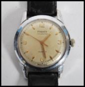 A vintage mid 20th century Phenix Chronostop 17 jewel Swiss made wrist watch having a silvered