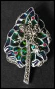 A 925 silver plique a jour figural brooch in the form of  a frog resting upon a leaf, set with red