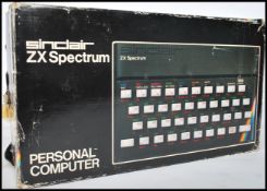 A boxed retro 1980s ZX Spectrum by Sinclair retaining the original box