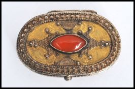 A vintage Kazakhstan silver gilt and Carnelian snuff box from Russian central Asia, fitted with a