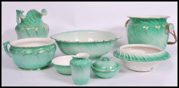 A 19th century Staffordshire ceramic bedroom set comprising washbowl and jug, large chamber bucket
