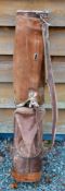 Leather circular golf club bag c/w with ball pocket (stitching coming away), shoulder strap and