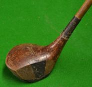R Simpson Carnoustie Juvenile round sole spoon - triangular fibre face insert with an oval makers
