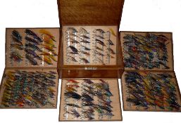 FLY CABINET: Fine Farlow of London oak fly reservoir containing a large collection of vintage salmon
