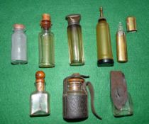 OIL BOTTLES: (8) Collection of 8 vintage fly and reel oil bottles, incl. a Helical Casting Co.,