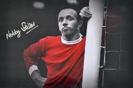 Nobby Stiles Signed Print in Manchester United Kit, framed and glazed measures 46 x 36cm approx.
