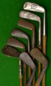8x Assorted Clubs including 6x Irons consisting of a Fairlie's patent mid-iron, a Forgan niblick,