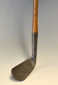 Dished faced mashie with indistinct makers markings pitted with punch dot central face markings,