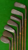 7x Assorted Clubs including 5x Irons a ridge back Spalding Sammy, a large head niblick, a deep faced
