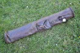 Early and interesting leather pencil patent golf bag c/w carry handle, ball pocket and embossed 