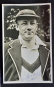 Sir Don Bradman Signed Cricket Photograph a black and white press photograph signed in blue ink to