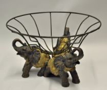 Trio Elephant Fruit Stand a large fruit stand with three elephants as a base with a circular wired