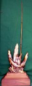 TROPHY: Cast brass angler's trophy by Fondarti?, showing a leaping fish hooked with rod and reel