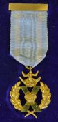 An interesting St Andrews Cross yellow metal medal c/w ribbon and bar, in makers original box Wilson