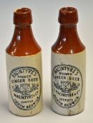 2x McIntyre North Berwick Ginger stone ware bottles - decorated with cross golf clubs and balls