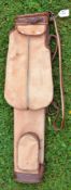 A good leather and canvas oval shaped golf bag c/w folding travel hood/pocket and ball pocket fitted