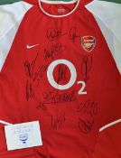 Arsenal Multi Signed Football Shirt signed to the front by 12, a replica, short sleeve red and white