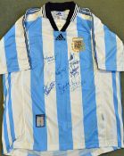 1990 Argentina international shirt with signatures of seven players. Given to the vendor by the