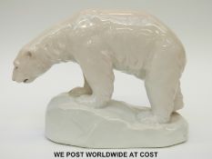 A continental porcelain figure of a polar bear with an anchor mark dividing to letter P's (18cm