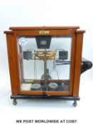 An Oerthing cased laboratory scale together with two Baird & Tatlock examples,