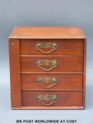 A Wellington chest style four drawer collector's cabinet (H30cm x W30cm x D26cm)