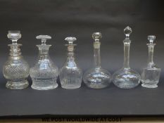 Six various clear cut glass decanters including a Scottish thistle decanter,