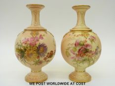 Royal Worcester pair of blush ivory pedestal vases decorated with flowers,