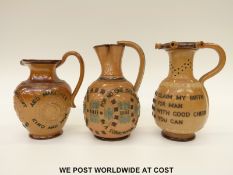 Three Doulton Lambeth motto jugs and puzzle jugs (tallest 18cm)