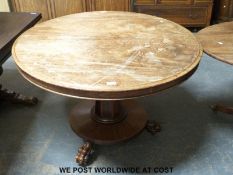 A 19thC mahogany circular breakfast table raised on lion paw feet (H71cm x D106cm)