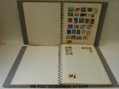 Two blue ring binder albums of all-world stamps