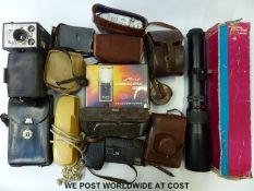 A quantity of cameras and accessories to include Zorki- 4, Photax 500mm lens,