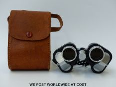 A cased pair of Orion 7 x 25 compact vintage binoculars