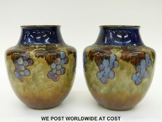 A pair of Royal Doulton vases decorated with bunches of grapes (17cm tall)