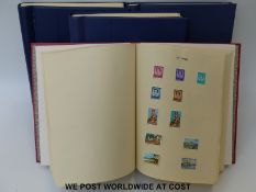 Four loose leaf albums of Queen Elizabeth II Commonwealth stamps,