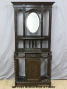 An oak hall stand with adjustable bevelled glass mirror (H195xW87xD30cm)